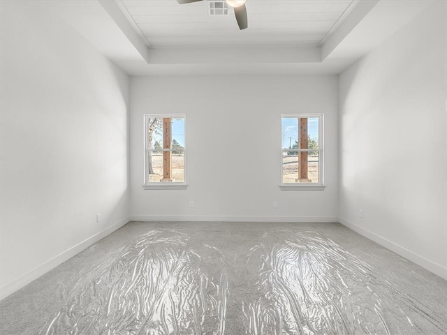 1092 S Mustang Rd, Blanchard, OK 73010 - empty room featuring a tray ceiling and a ceiling fan
