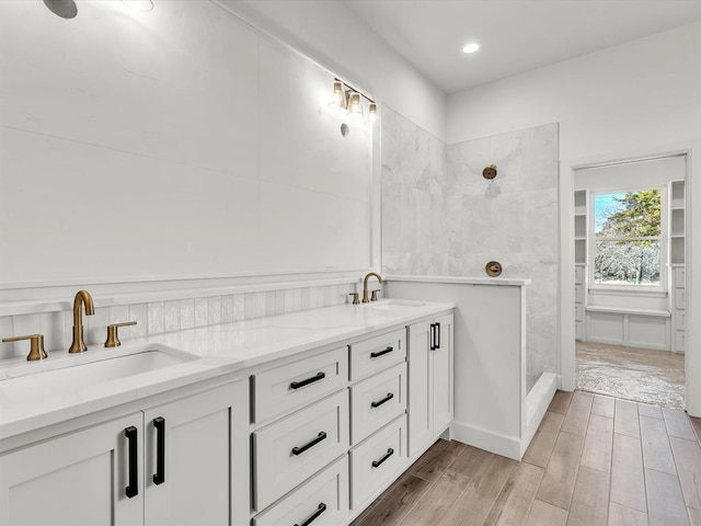 1092 S Mustang Rd, Blanchard, OK 73010 - bathroom with tiled shower, wood finished floors, double vanity, and recessed lighting