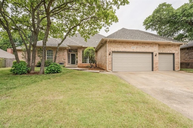 2717 Asheforde Oaks Blvd, Edmond, OK 73034 - view of front facade featuring brick siding, a garage, concrete driveway, and a shingled roof