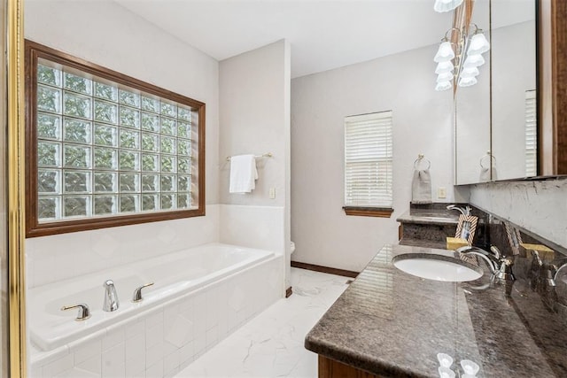 2717 Asheforde Oaks Blvd, Edmond, OK 73034 - bathroom with double vanity, a garden tub, and marble finish floors