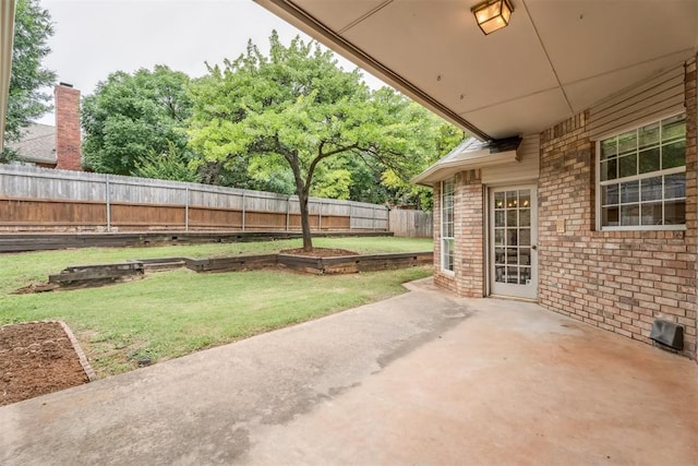 2717 Asheforde Oaks Blvd, Edmond, OK 73034 - fenced backyard with a patio area