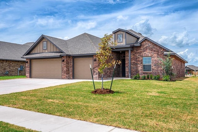 2013 W Crossbow Way, Mustang, OK 73064 - craftsman-style home featuring brick siding, a garage, a front lawn, and board and batten siding