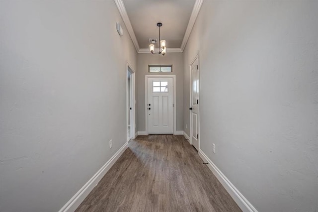 2013 W Crossbow Way, Mustang, OK 73064 - doorway to outside with crown molding and wood finished floors