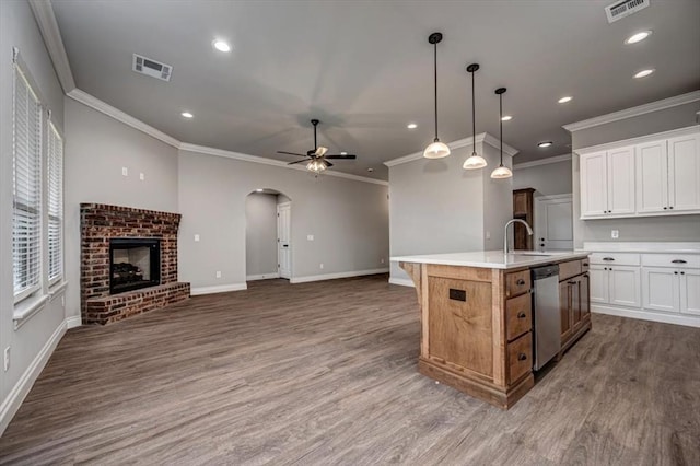 2013 W Crossbow Way, Mustang, OK 73064 - kitchen featuring dishwasher, ornamental molding, arched walkways, wood finished floors, and recessed lighting