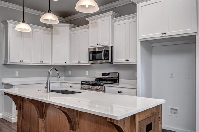 2013 W Crossbow Way, Mustang, OK 73064 - kitchen featuring appliances with stainless steel finishes, white cabinetry, light countertops, and ornamental molding