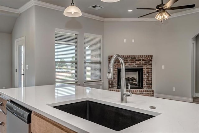 2013 W Crossbow Way, Mustang, OK 73064 - kitchen with ceiling fan, ornamental molding, a brick fireplace, dishwasher, and pendant lighting