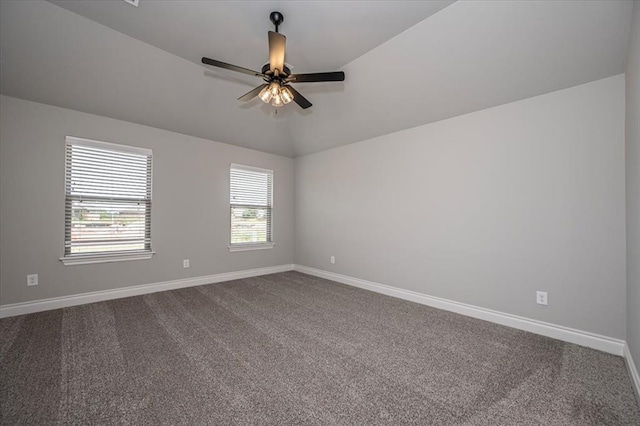 2013 W Crossbow Way, Mustang, OK 73064 - spare room with dark colored carpet, vaulted ceiling, and a ceiling fan