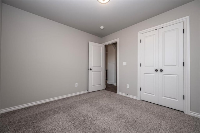 2013 W Crossbow Way, Mustang, OK 73064 - unfurnished bedroom featuring carpet floors and a closet