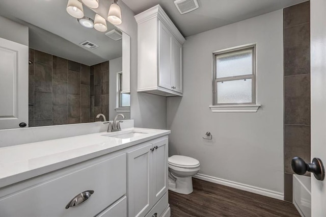 2013 W Crossbow Way, Mustang, OK 73064 - bathroom with vanity, a shower, wood finished floors, and plenty of natural light