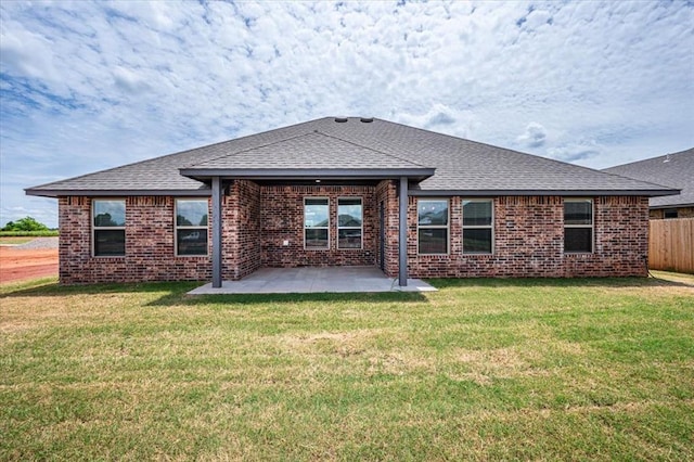 2013 W Crossbow Way, Mustang, OK 73064 - rear view of property with roof with shingles, brick siding, and a patio
