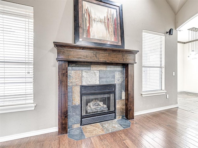 2311 Washita Trl, Edmond, OK 73003 - detailed view of a tiled fireplace and wood finished floors