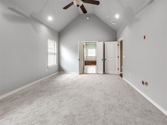 2311 Washita Trl, Edmond, OK 73003 - unfurnished bedroom featuring high vaulted ceiling, carpet, recessed lighting, ensuite bath, and ceiling fan