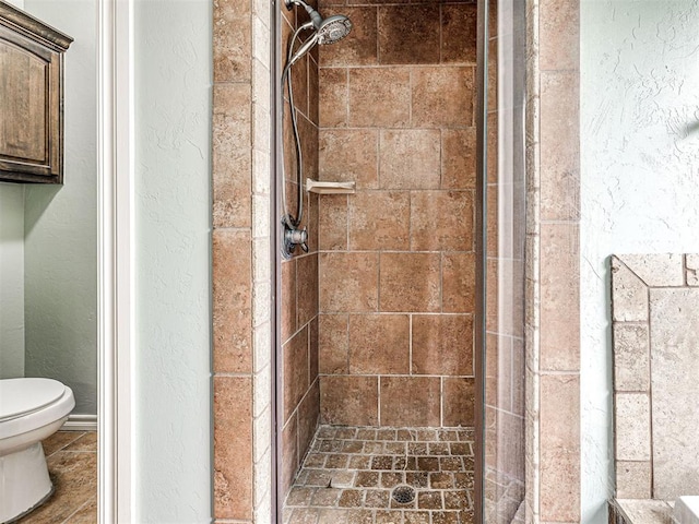2311 Washita Trl, Edmond, OK 73003 - bathroom featuring a shower stall and a textured wall