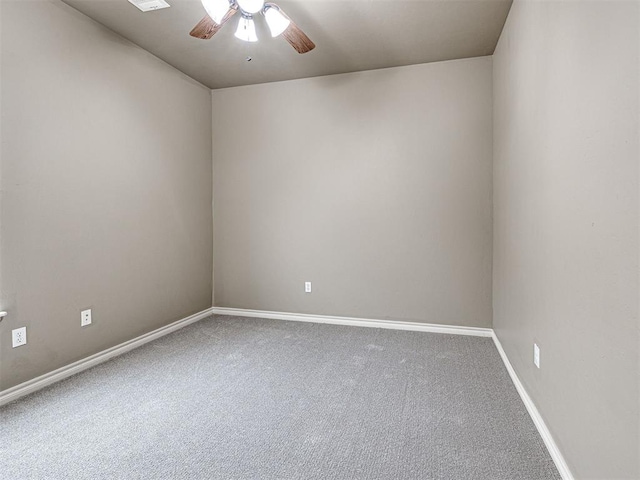 2311 Washita Trl, Edmond, OK 73003 - carpeted spare room with a ceiling fan and baseboards