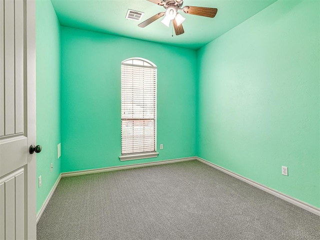 2311 Washita Trl, Edmond, OK 73003 - carpeted empty room featuring baseboards and a ceiling fan