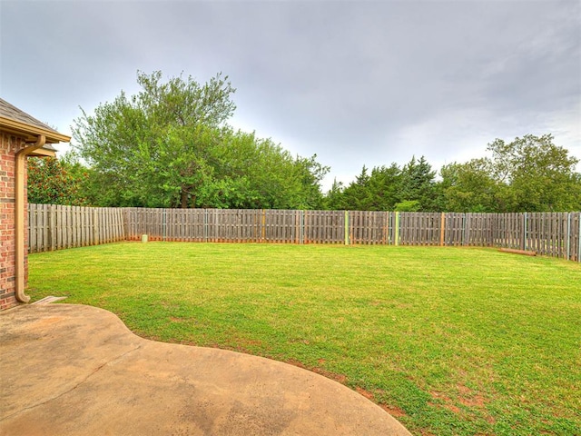 2311 Washita Trl, Edmond, OK 73003 - fenced backyard with a patio area