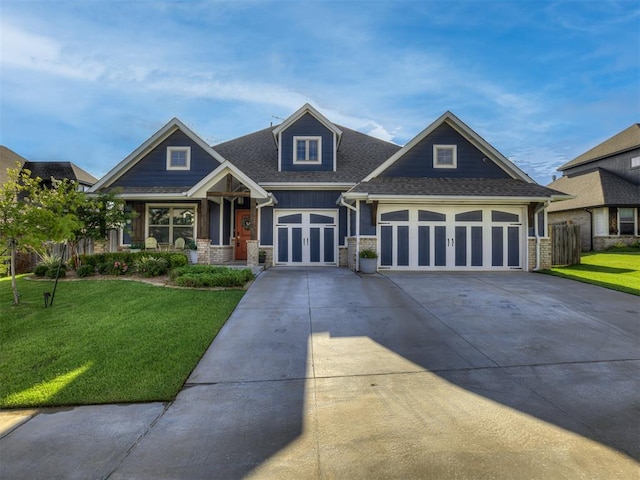 15913 Windrush Pl, Edmond, OK 73013 - craftsman-style house featuring a front lawn, concrete driveway, roof with shingles, french doors, and an attached garage
