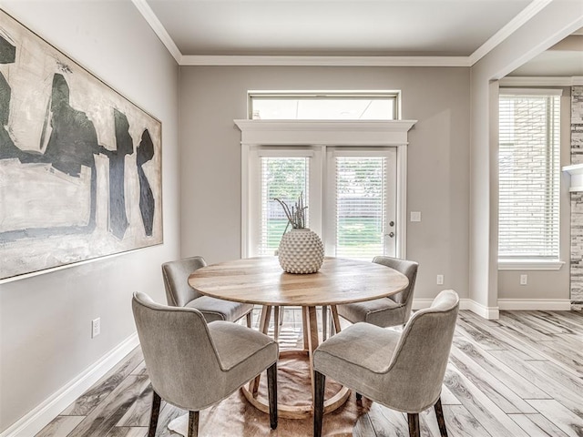 15913 Windrush Pl, Edmond, OK 73013 - dining space featuring light wood finished floors and crown molding