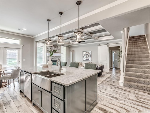 15913 Windrush Pl, Edmond, OK 73013 - kitchen with a barn door, gray cabinets, open floor plan, coffered ceiling, and ornamental molding