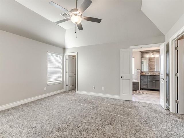 15913 Windrush Pl, Edmond, OK 73013 - unfurnished bedroom featuring high vaulted ceiling, light colored carpet, ensuite bath, and ceiling fan