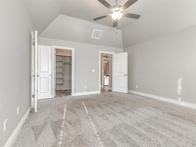 15913 Windrush Pl, Edmond, OK 73013 - unfurnished bedroom with carpet floors, a spacious closet, ceiling fan, a closet, and high vaulted ceiling