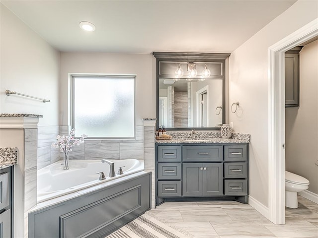 15913 Windrush Pl, Edmond, OK 73013 - bathroom featuring vanity and a garden tub