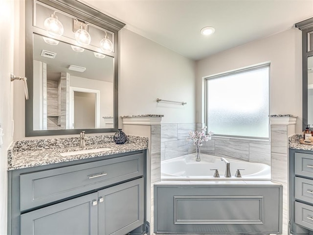 15913 Windrush Pl, Edmond, OK 73013 - full bathroom with vanity and a bath