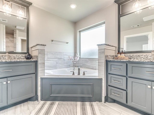 15913 Windrush Pl, Edmond, OK 73013 - full bath featuring two vanities and a garden tub
