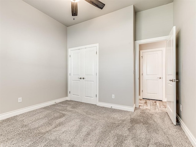15913 Windrush Pl, Edmond, OK 73013 - unfurnished bedroom featuring light colored carpet, ceiling fan, and a closet