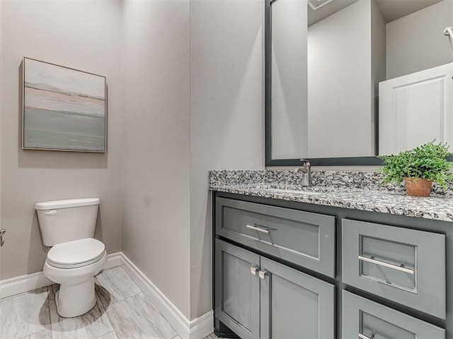 15913 Windrush Pl, Edmond, OK 73013 - half bathroom featuring vanity and marble look tiles