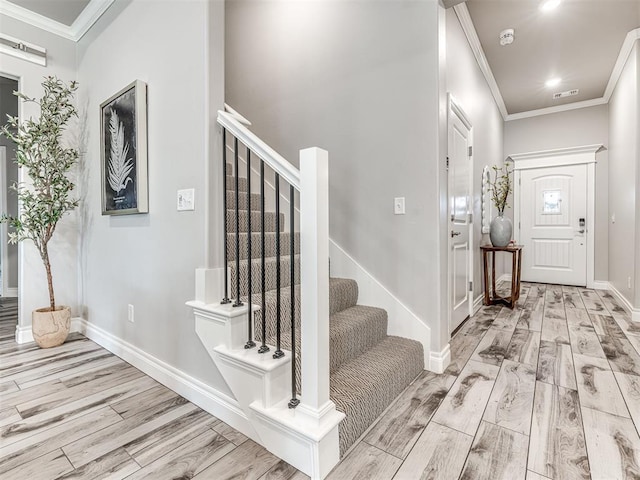 15913 Windrush Pl, Edmond, OK 73013 - foyer with wood finished floors, crown molding, and stairway