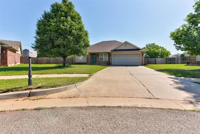 13664 NW Bradbury Ln, Piedmont, OK 73078 - view of front of home featuring driveway, brick siding, and a garage