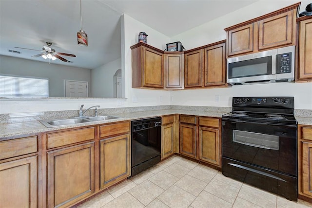 13664 NW Bradbury Ln, Piedmont, OK 73078 - kitchen with black appliances, ceiling fan, light tile patterned floors, and brown cabinetry