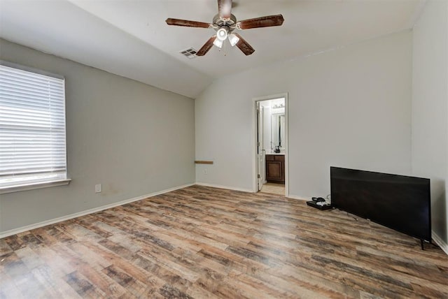 13664 NW Bradbury Ln, Piedmont, OK 73078 - spare room featuring vaulted ceiling, ceiling fan, and wood finished floors