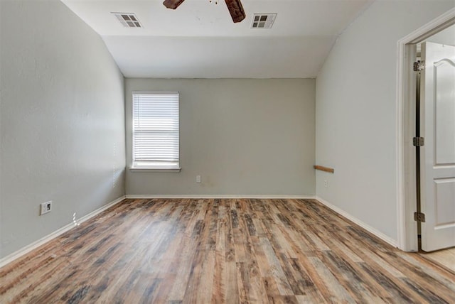 13664 NW Bradbury Ln, Piedmont, OK 73078 - empty room featuring vaulted ceiling, wood finished floors, and ceiling fan