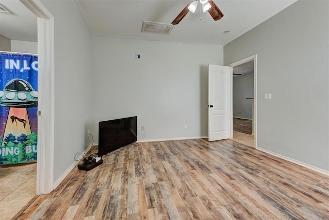 13664 NW Bradbury Ln, Piedmont, OK 73078 - unfurnished living room featuring wood finished floors and ceiling fan