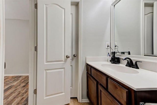 13664 NW Bradbury Ln, Piedmont, OK 73078 - bathroom with vanity and wood finished floors