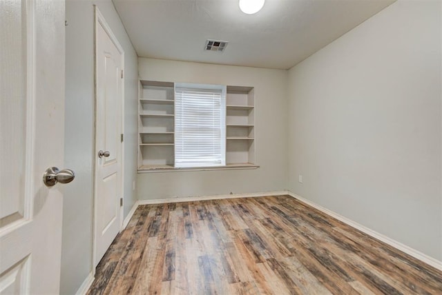 13664 NW Bradbury Ln, Piedmont, OK 73078 - empty room with wood finished floors and baseboards