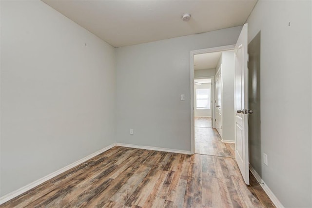 13664 NW Bradbury Ln, Piedmont, OK 73078 - spare room with wood finished floors and a smoke detector