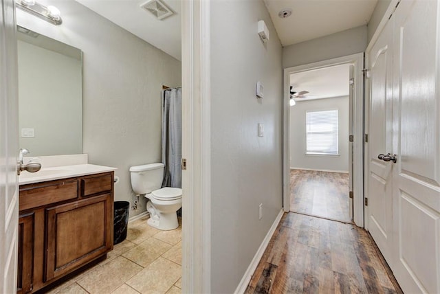 13664 NW Bradbury Ln, Piedmont, OK 73078 - full bath featuring vanity, wood finished floors, and a shower with shower curtain