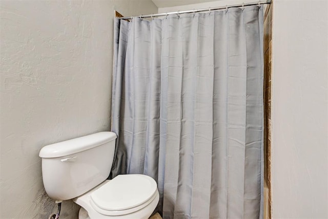 13664 NW Bradbury Ln, Piedmont, OK 73078 - full bathroom with curtained shower and a textured wall