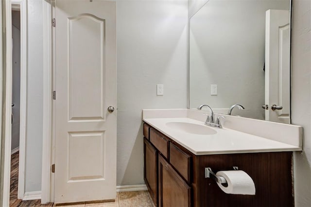 13664 NW Bradbury Ln, Piedmont, OK 73078 - bathroom featuring vanity and baseboards