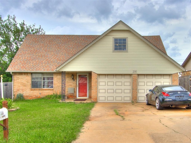 200 S Morgan Dr, Moore, OK 73160 - traditional-style house featuring driveway, brick siding, and a shingled roof