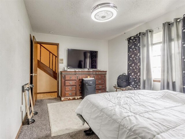 200 S Morgan Dr, Moore, OK 73160 - bedroom featuring carpet flooring and a textured ceiling
