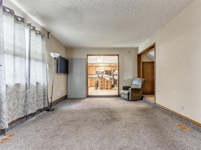 200 S Morgan Dr, Moore, OK 73160 - unfurnished room with a textured ceiling and carpet flooring