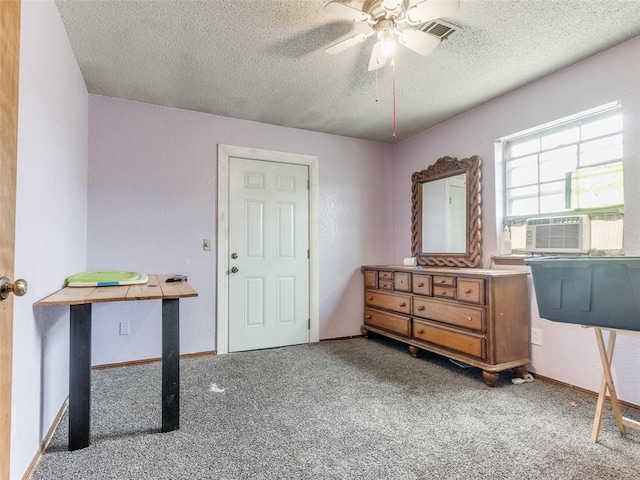 200 S Morgan Dr, Moore, OK 73160 - bedroom with carpet, a textured ceiling, cooling unit, and ceiling fan