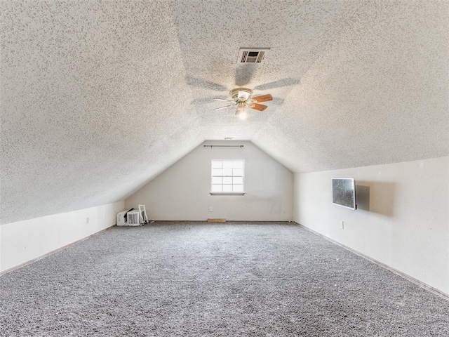 200 S Morgan Dr, Moore, OK 73160 - bonus room with lofted ceiling, a textured ceiling, ceiling fan, and carpet