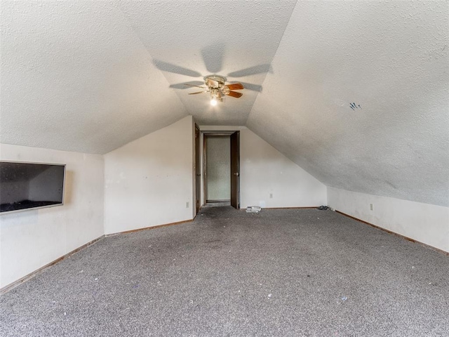 200 S Morgan Dr, Moore, OK 73160 - bonus room with a textured ceiling, ceiling fan, vaulted ceiling, and carpet