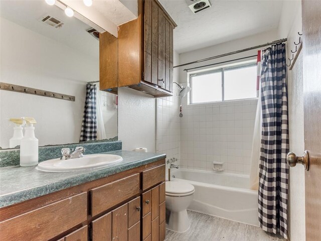 200 S Morgan Dr, Moore, OK 73160 - bathroom with shower / tub combo with curtain, vanity, and wood finished floors
