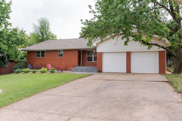 320 E 13th St, Edmond, OK 73034 - ranch-style house with brick siding, driveway, a front yard, and an attached garage